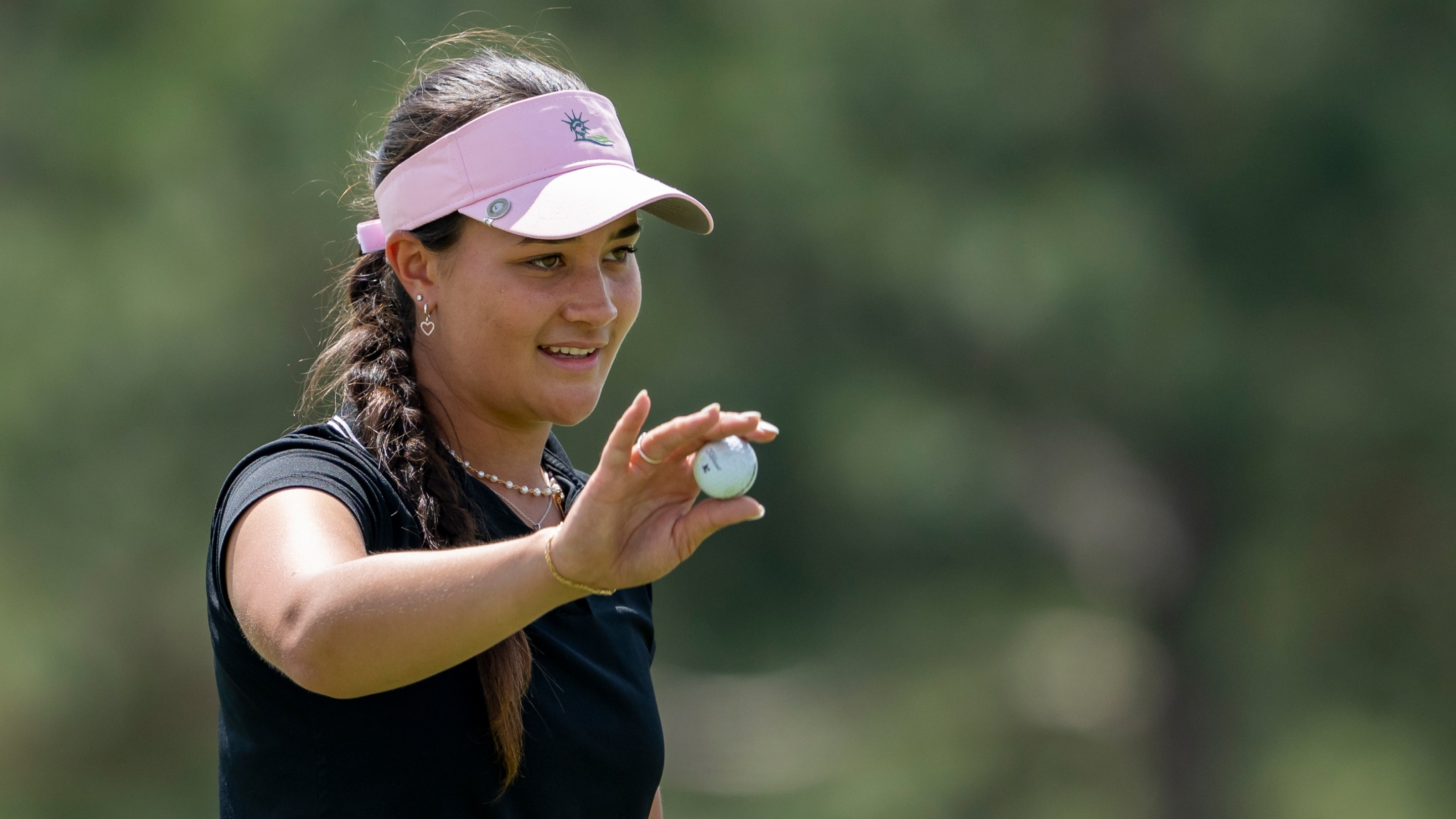 Kiara Romero of United States putts out at No. 18 during the final ...
